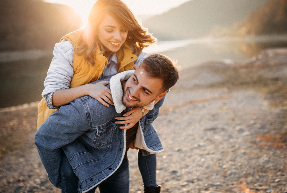 Couple giving piggyback ride