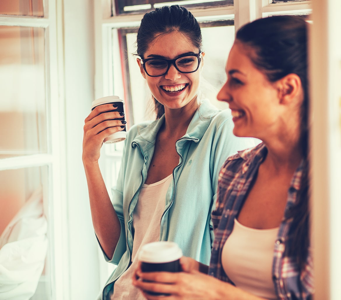 two woman smiling